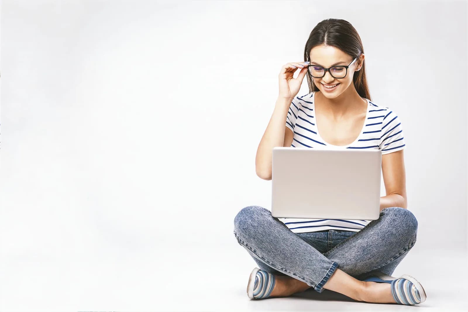 An adult learner sitting with a laptop