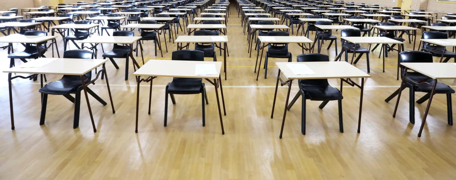 Rows of exam desks in an examination hall