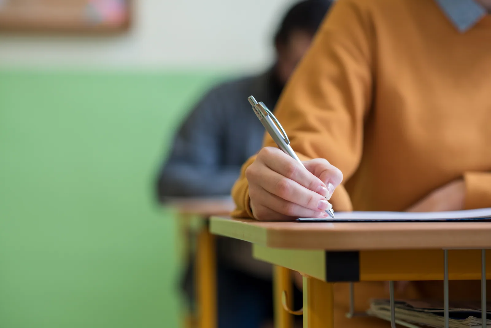 A student writing during an exam